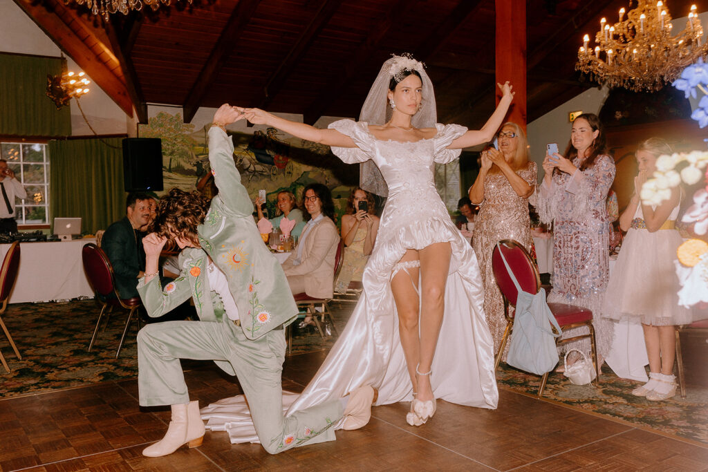 bride dancing with her wedding guests 