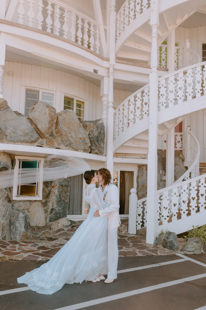 picture of the bride and groom kissing 