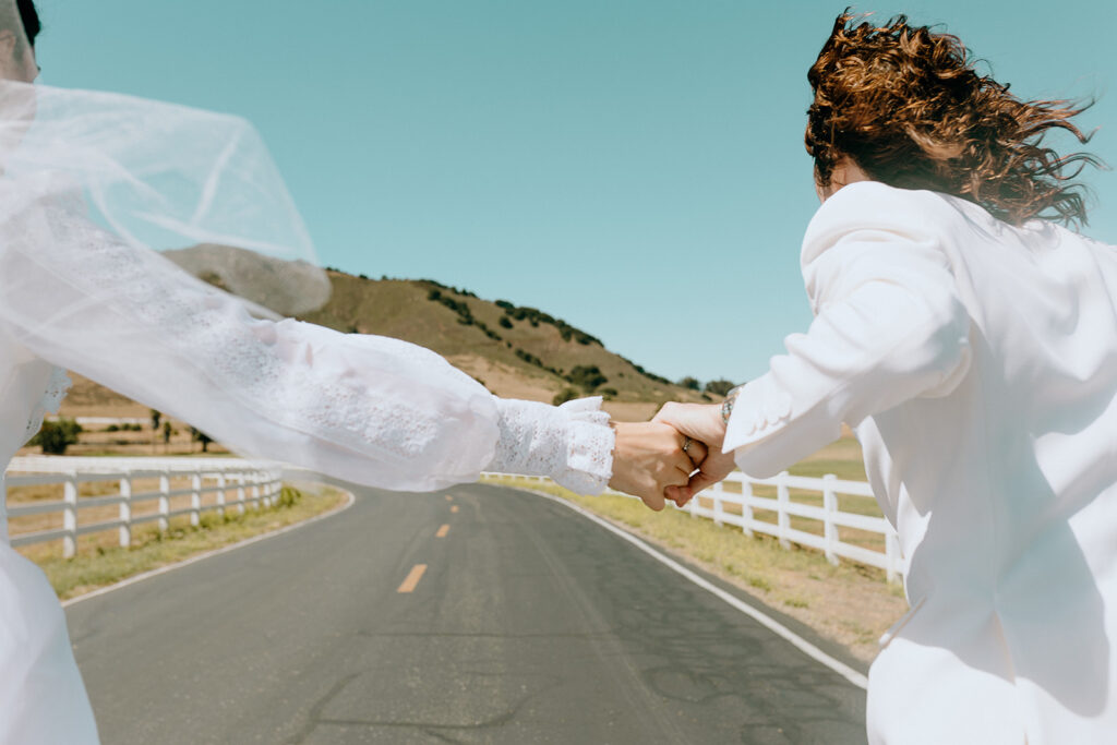 bride and groom running during their photshoot