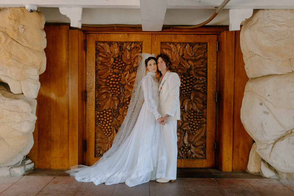 bride and groom posing for the camera before the ceremony