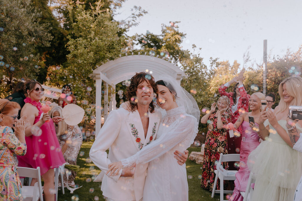 happy newly married couple heading to their ceremony 