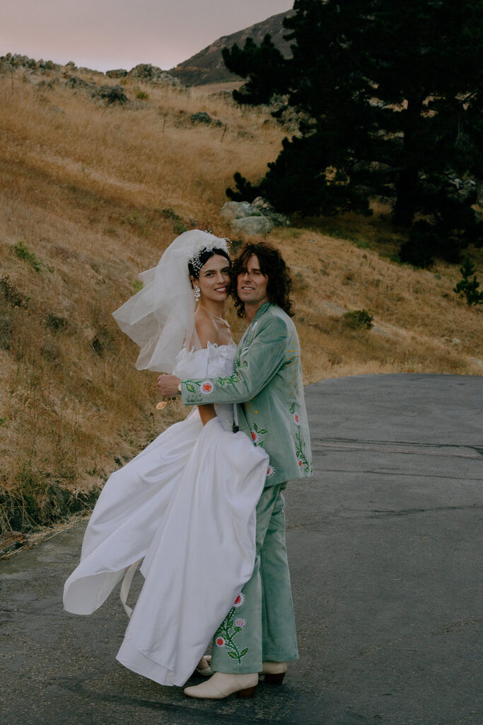 picture of the bride and groom hugging 