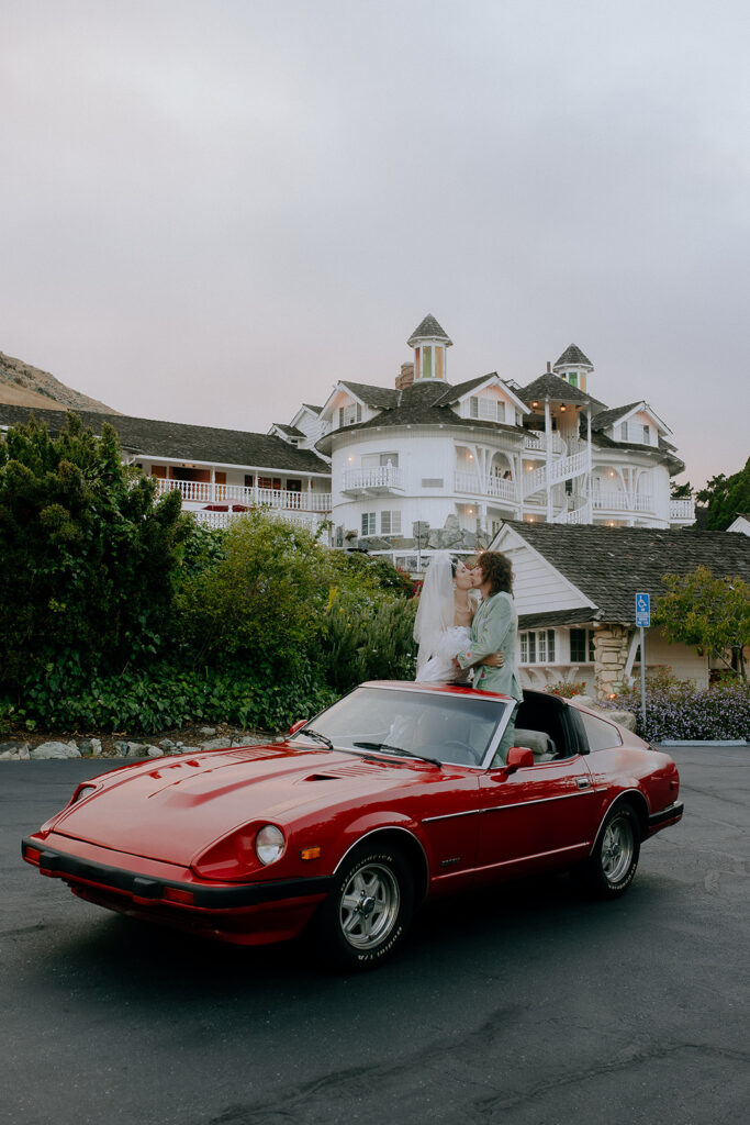 newly married couple with their dream car 