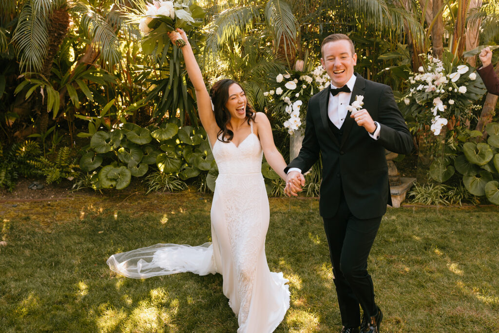 couple celebrating after their ceremony 