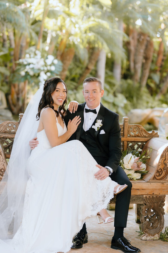 bride and groom looking at the camera during their photoshoot at their dream beach wedding 