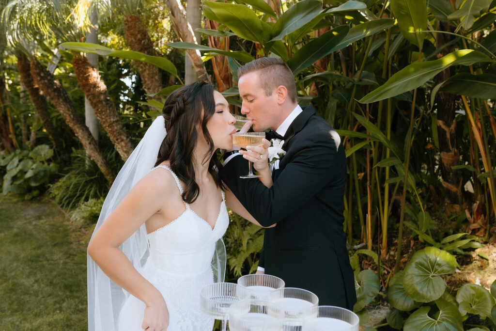 bride and groom celebrating with champagne