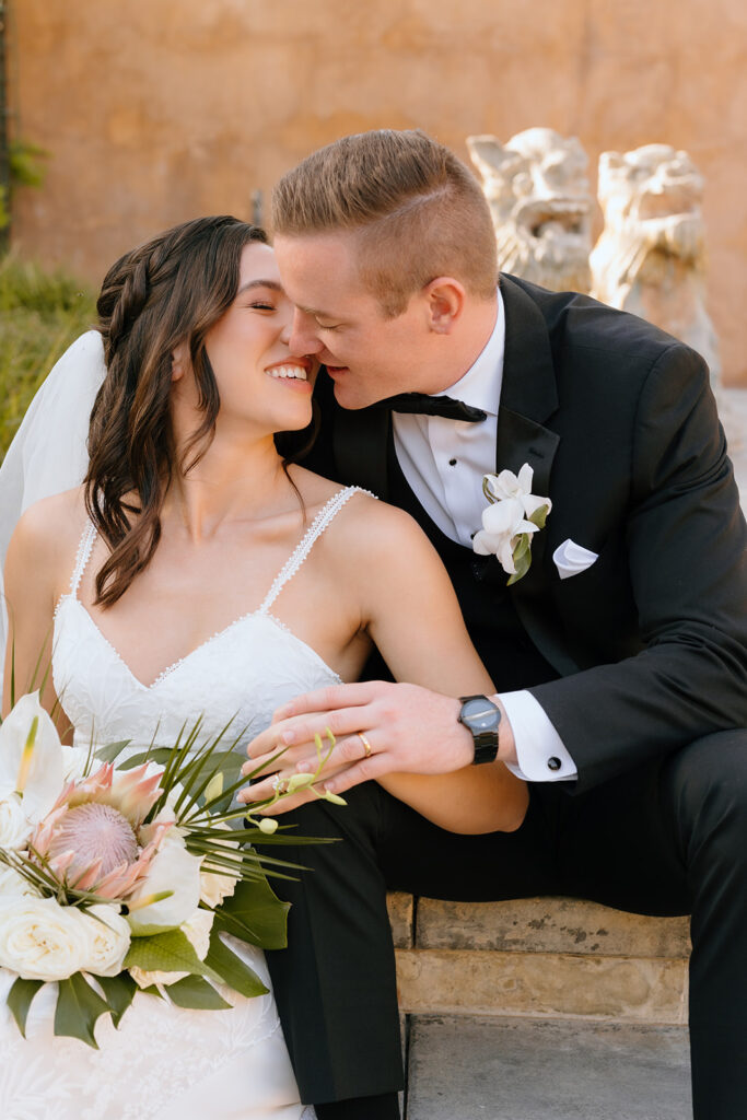 picture of the newlyweds smiling at each other 