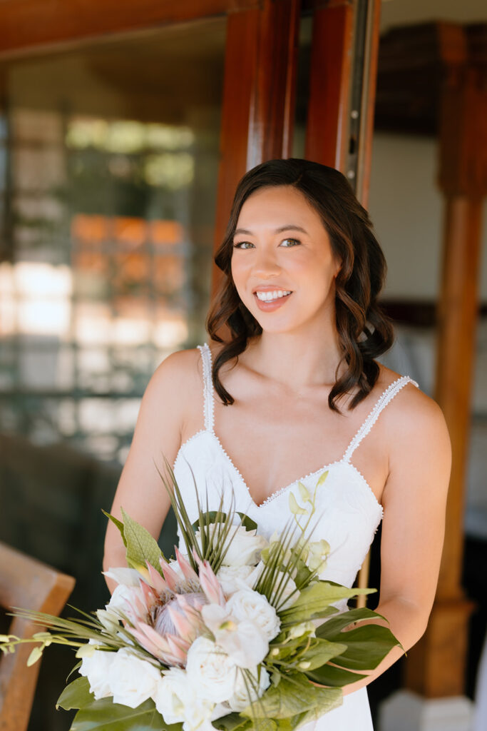 cute picture of the bride holding her colorful wedding bouquet 