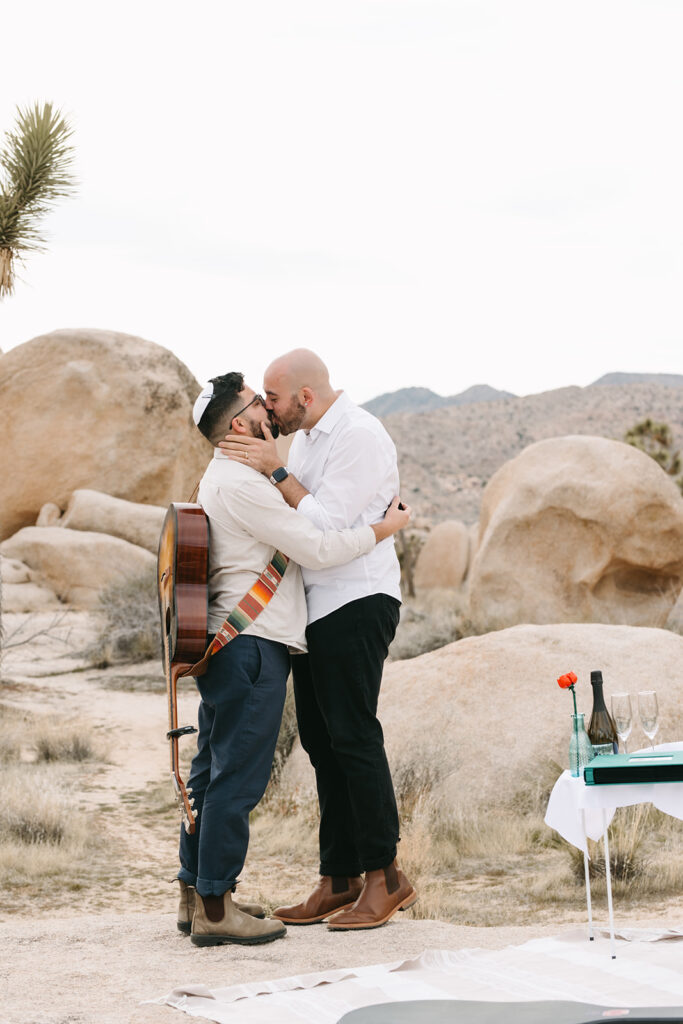 cute couple kissing after their LGBTQ spring proposal