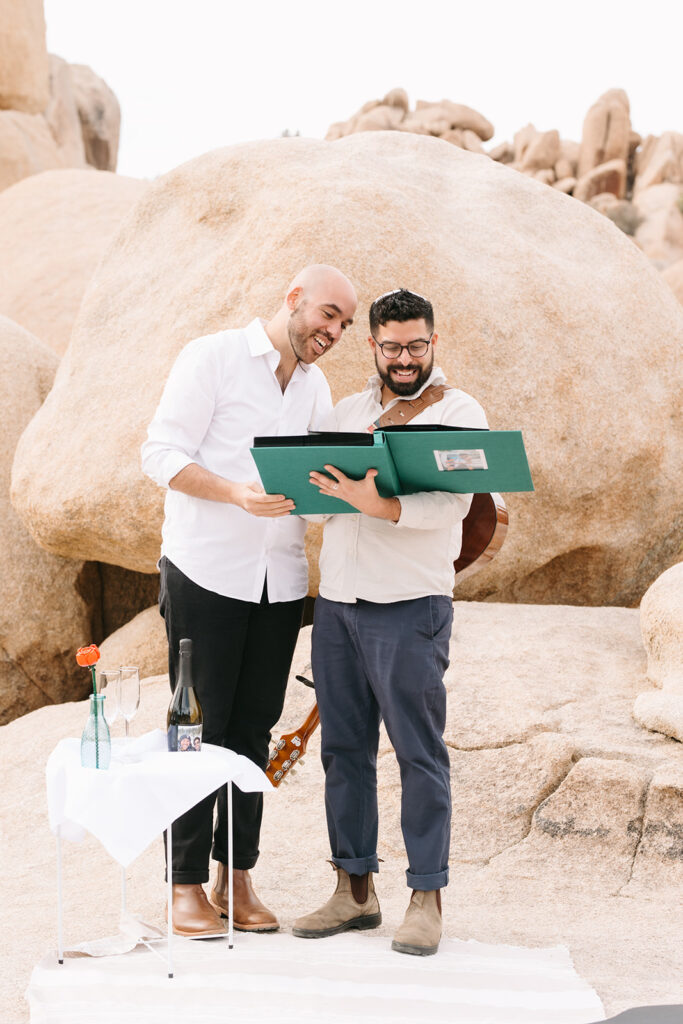 couple looking at an adventure photo album