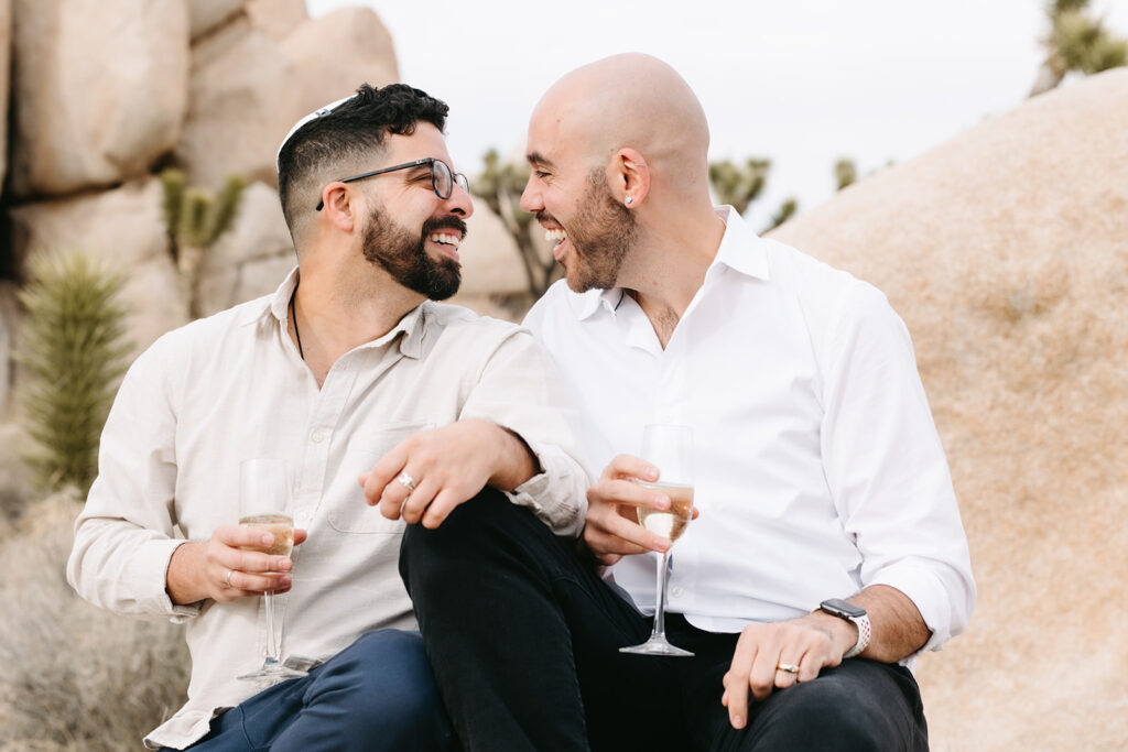 cute couple looking at each other during their spring proposal photoshoot