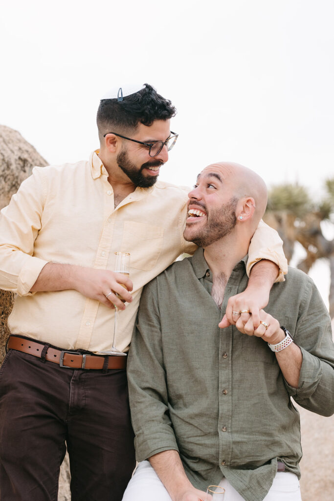 couple looking and smiling at each other at their LGBTQ spring proposal