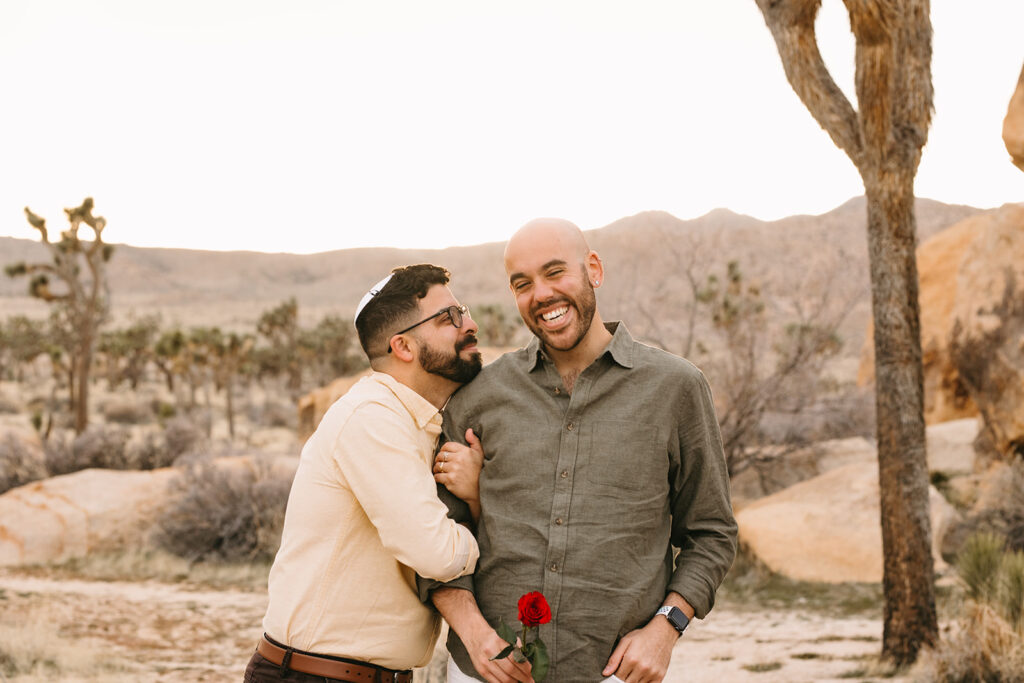 happy couple at their LGBTQ spring proposal at the stunning joshua tree