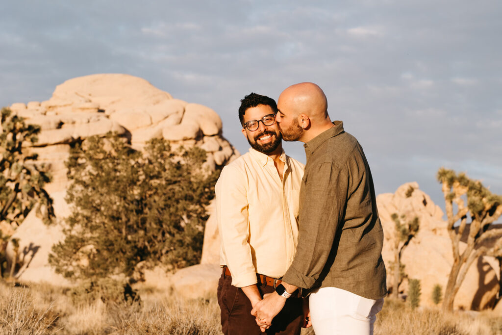 fiance kissing his fiance on the cheek 