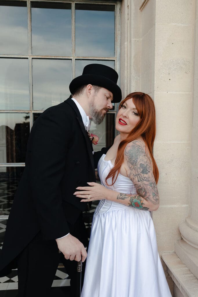 groom kissing the bride on the cheek