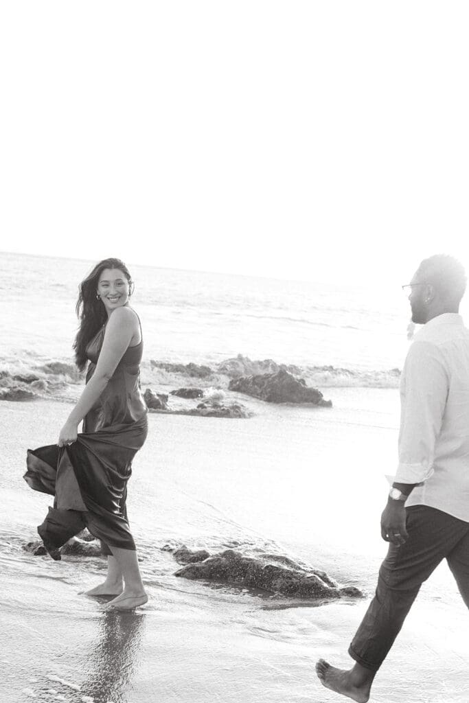 couple walking around the beach during their photoshoot