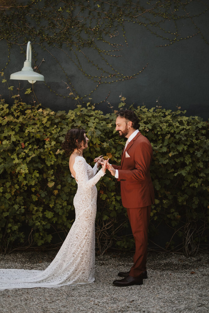 cute picture of the bride and groom holding hands