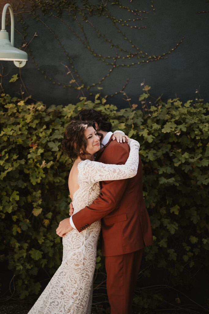 beautiful picture of the bride and groom hugging