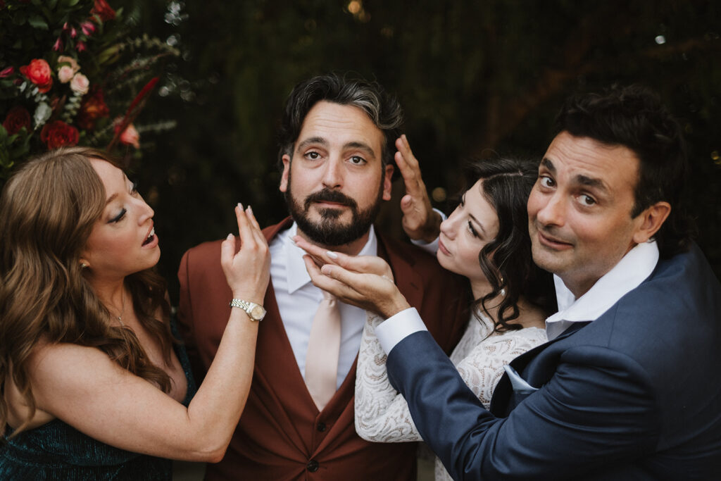 picture of the newlyweds and their families after the ceremony