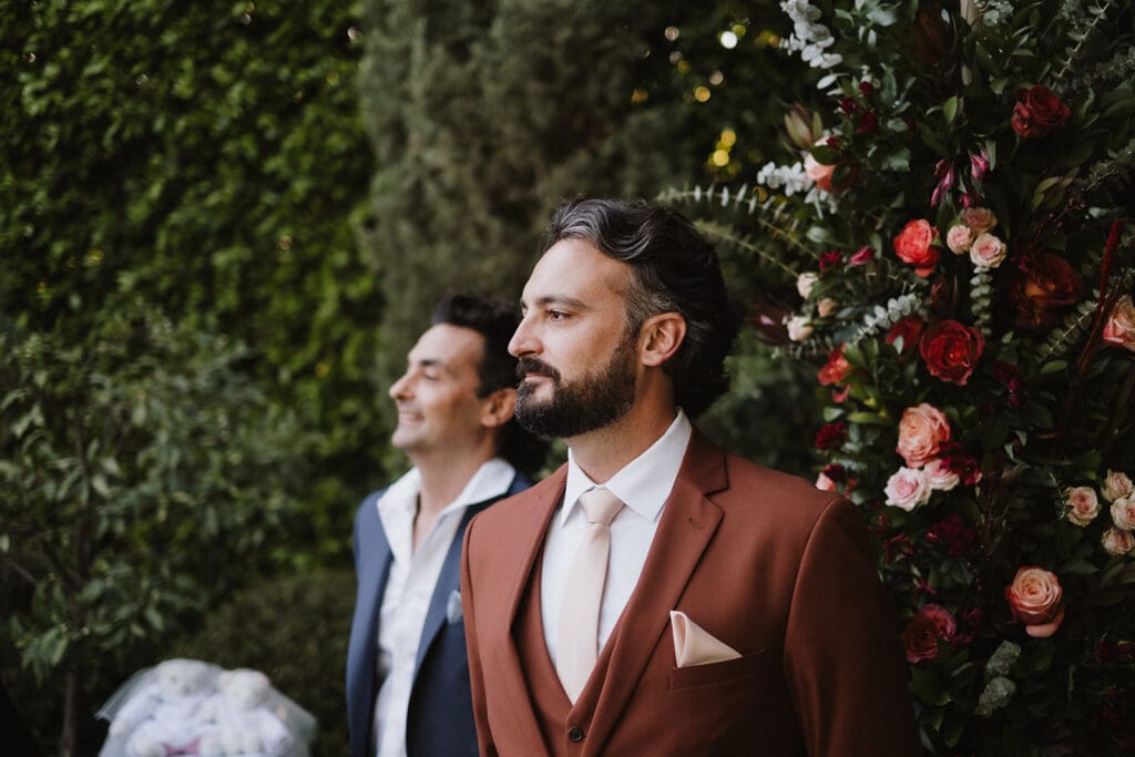 groom watching the bride walk down the aisle