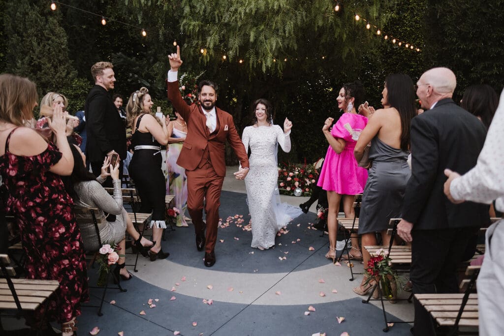 cute picture of the newly married couple heading to their reception