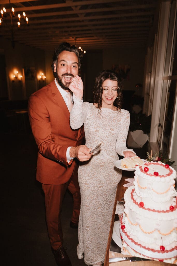 newlyweds cutting their wedding cake
