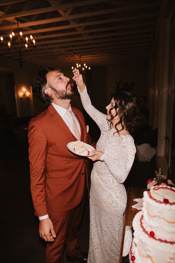 newlyweds cutting their wedding cake