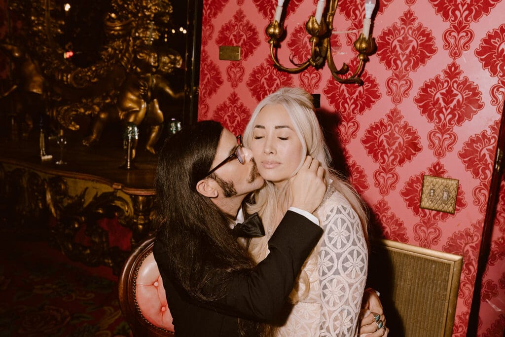 Fiancé, kissing his fiancé on the cheek